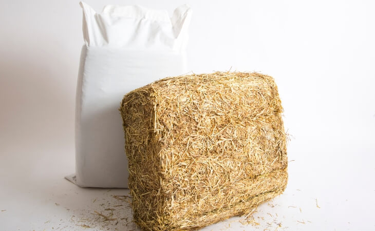 An image of both wrapped and unwrapped low sugar meadow hay for horses