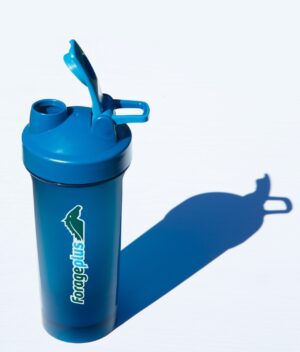 The Forageplus Horse Supplement Shaker casting a shadow onto a grey background.