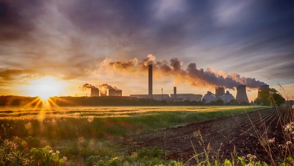 Sunrise over industrial power station